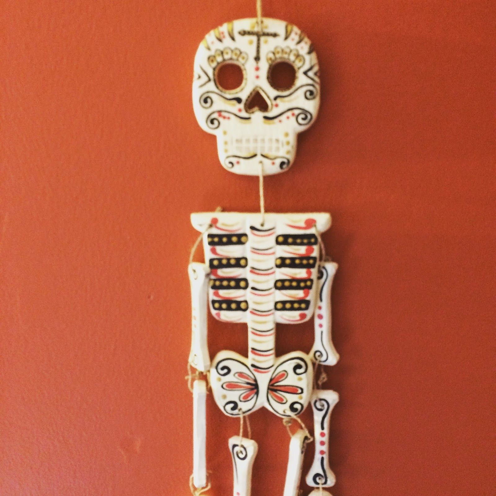 A Dia de Los Muertos skeleton wall hanging