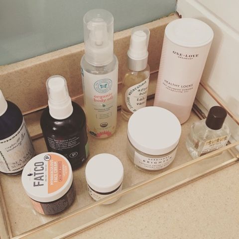 The top of a bathroom counter showing oils and soaps