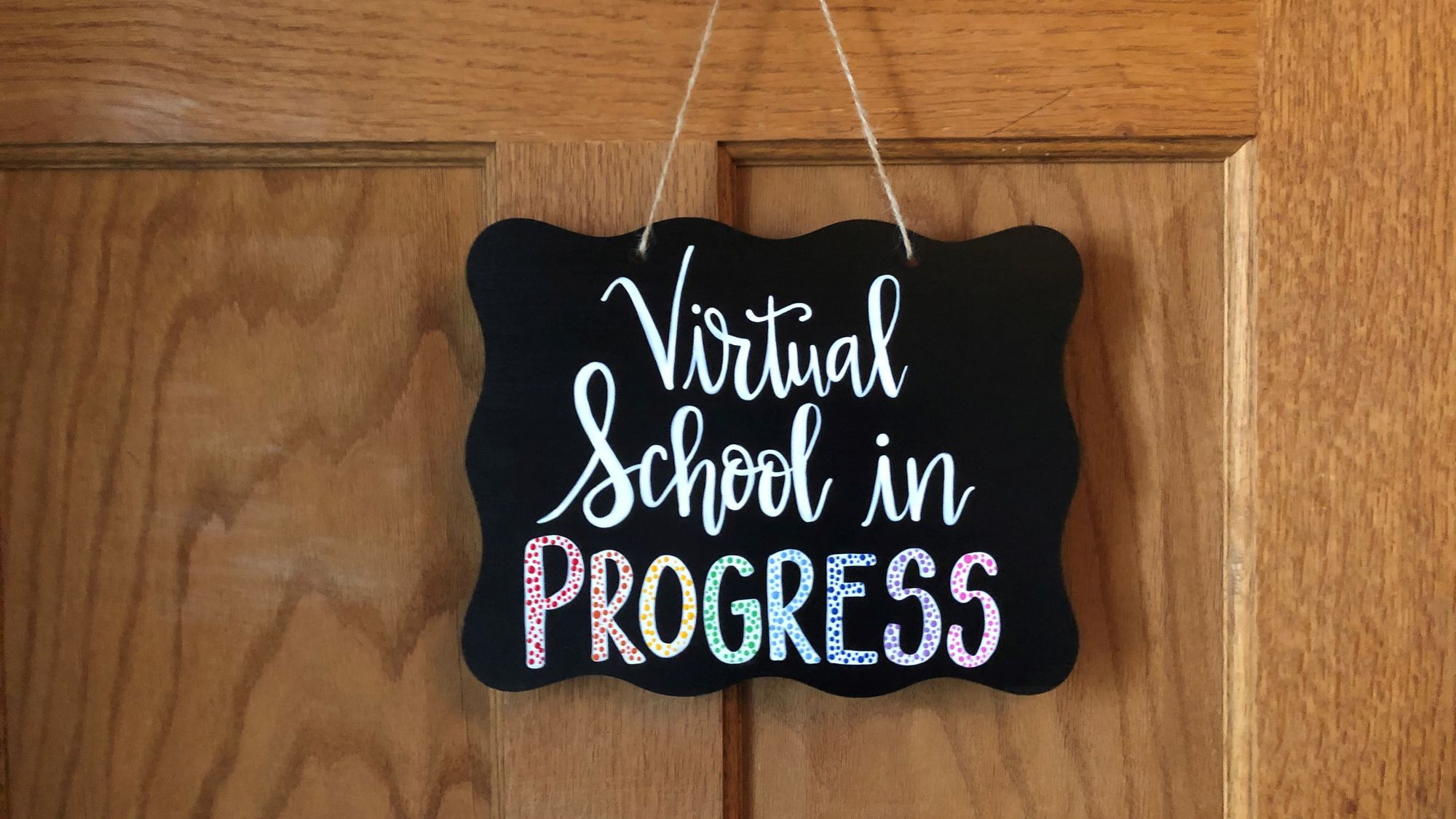 A sign that says "Virtual School in Progress"